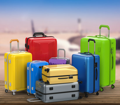 colorful luggages on airport background