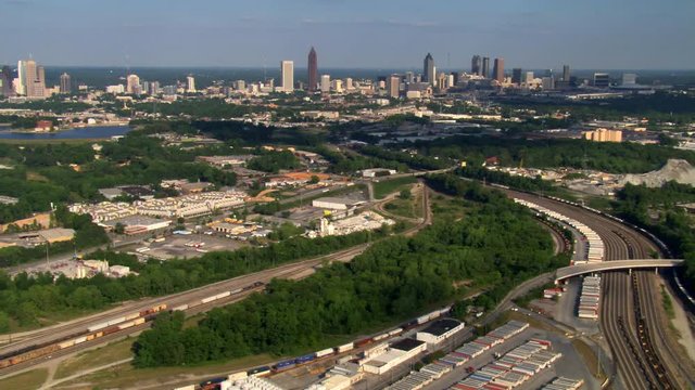 Flying over railyard to distant view of Midtown Atlanta, Georgia. Shot in 2007.