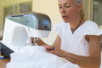 seamstress using sewing machine