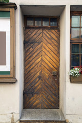 Ancient wooden door. Street facade. Riga. Latvia, Europe.