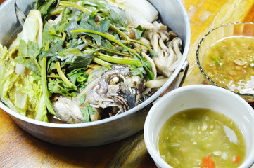 steam mango fish with vegetable in stainless steamer pot and sauce