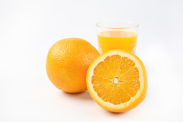 Orange juice and slices of orange isolated on white