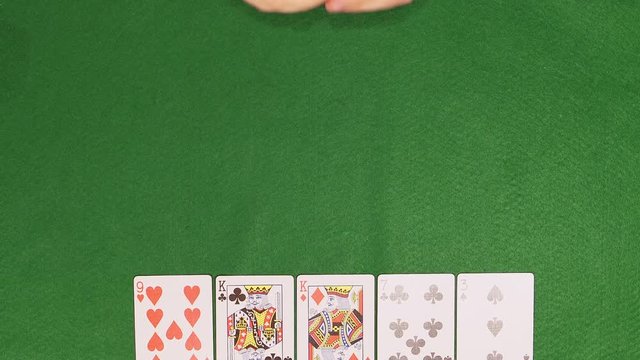 POKER: Player opens his cards and takes an all chips (top view)