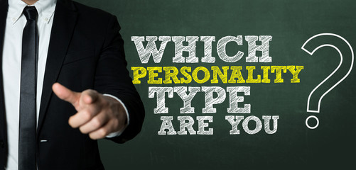 Business man pointing with the text: Which Personality Type Are You?