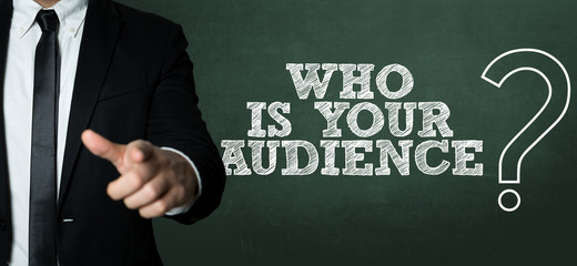 Business man pointing with the text: Who Is Your Audience?