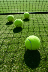 selective focus. tennis ball back light shadow on tennis grass c