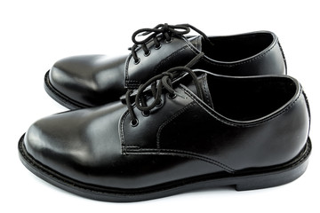 Black leather shoes on a white background