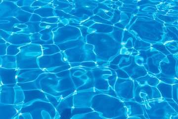 Fototapeta na wymiar Hotel swimming pool with sunny reflections