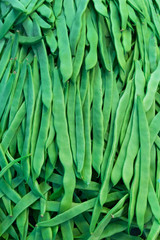 Heap green beans on the market