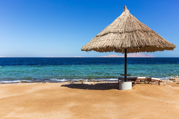 Beautiful beach with an umbrella in Egypt
