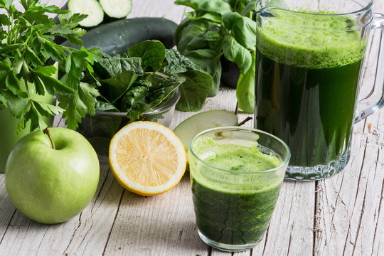 Green Smootie On A Wooden Board