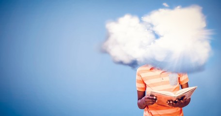 Composite image of cute boy reading book in library