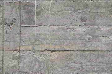 Concrete wall with cement sags close up