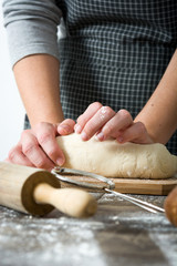Woman making bread with her hands

