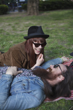 Young couple enjoying a picnic in the park