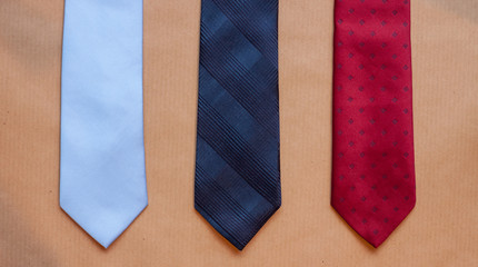 three ties on craft background