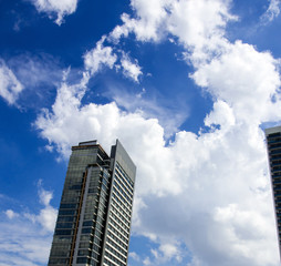 Clear with white clouds, blue skies, open air.