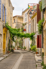 Fototapeta na wymiar Colourful street in the city of Arles in the Bouches du Rhone