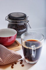 coffee cup /red cup on wooden tray/Plaid fabric and coffee bean