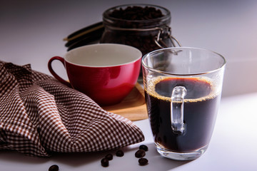 coffee cup /red cup on wooden tray/Plaid fabric and coffee bean