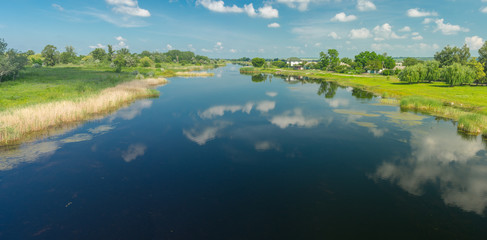 Fototapeta na wymiar Summer panoramic landscape with small river Oril near Pekelne village in Ukraine