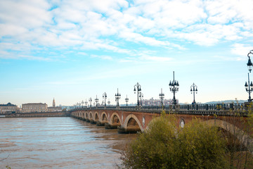 Old stony bridge in Bordeaux, France Europe