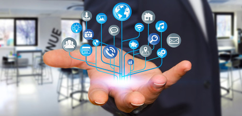 Businessman using modern digital electronic circuit with icons