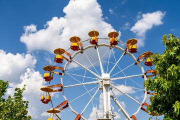 Giant Ferris Wheel In Fun Park On Blue Sky