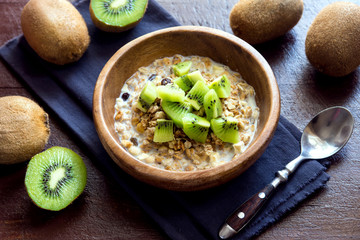 Homemade granola with milk and kiwi