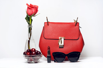 Fashion woman accessories. Handbag and sunglasses