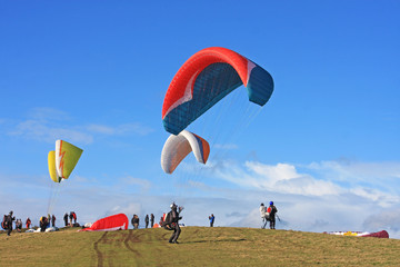 Paragliders preparing to fly