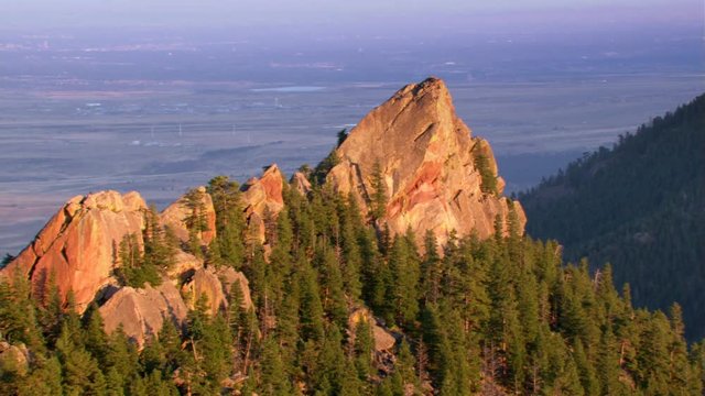 Flight over red rock peak in Colorado Rockies