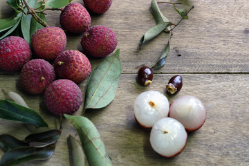 Fresh lychees on wood background, select focut