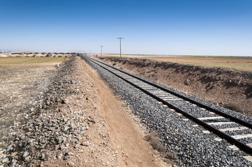 Conventional rail in an agricultural landscape in Toledo Province, Spain.