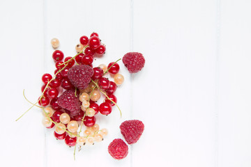 Summer berries on a wooden background