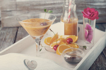 Orange cocktail with ice in a glass