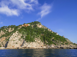Fototapeta na wymiar Rocky terraces on the Mediterranean coast at Capri Island