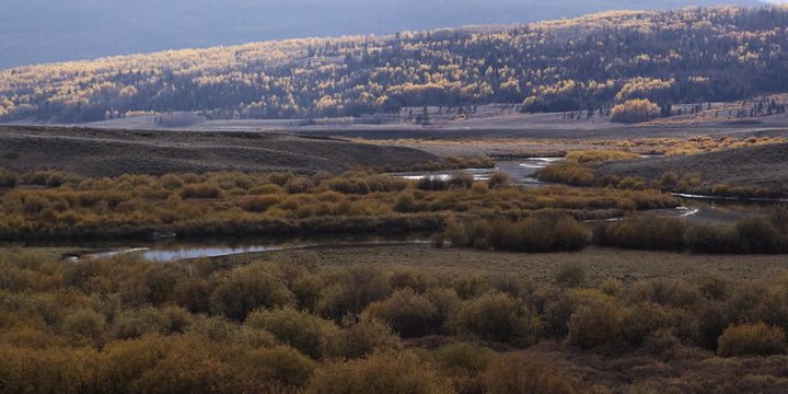 Timelapse autumn scrublands and winding river in Green River Valley, Wyoming