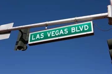 Poster Las Vegas Blvd. road sign hangs from a traffic light pole in Las Vegas, Nevada, USA. © sframe