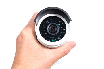 Hand holding modern surveillance camera isolated on white backgr