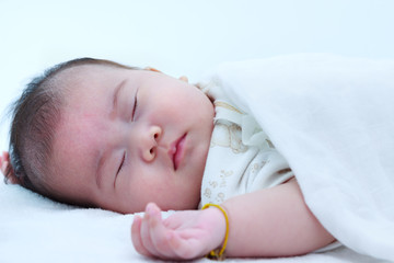 Closeup portrait of a beautiful sleeping baby.