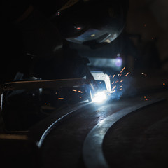 Industrial Worker at the factory welding closeup