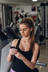 Girl with phone posing for the camera