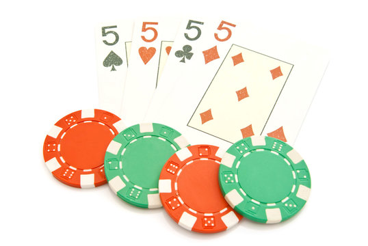four playing cards and plastic chips
