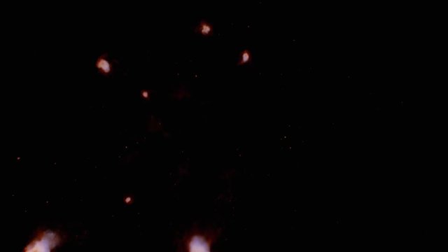 Explosion with purple comets streaking toward camera