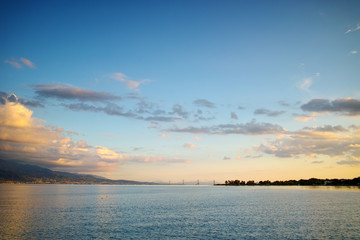 Obraz premium Sunset over The cable bridge between Rio and Antirrio view from Nafpaktos, Patra, Western Greece