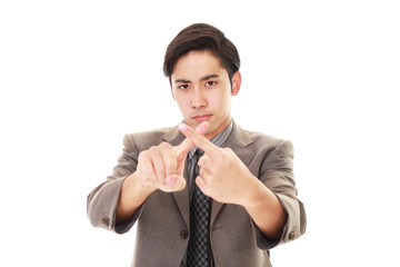 禁止の意思表示をするビジネスマン