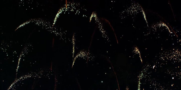 Several White And Gold Fireworks Burst, Raining Down Silver And Gold Sparks