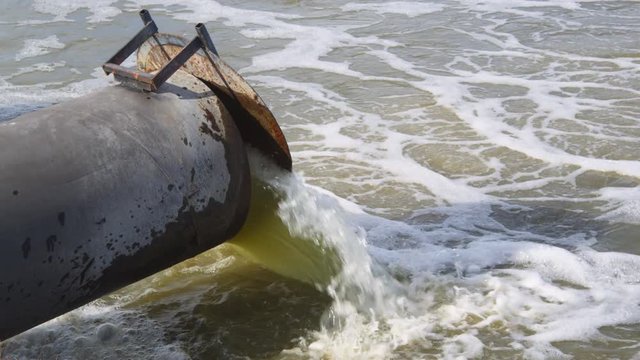 Pipe dumping greenish water into Tule Lake