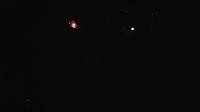 Fireworks with multiple explosions from below frame